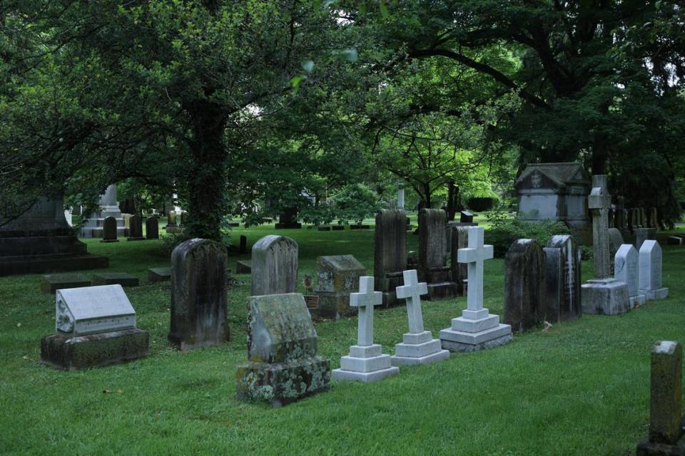 Headstone markers of Breckinridge family members next to John Cabell Breckinridge monument at the Lexington Cemetery in Lexington, Ky on May 9, 2024.