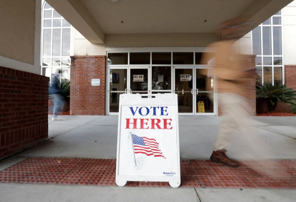 A voting sign sits outside Coastal Cathedral Church in Savannah during last year's senate runoff.