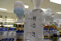 Masks and hand sanitizers are displayed at a Hyundai Happy World supplements store during the coronavirus outbreak in Niles, Ill., Friday, April 3, 2020. (AP Photo/Nam Y. Huh)