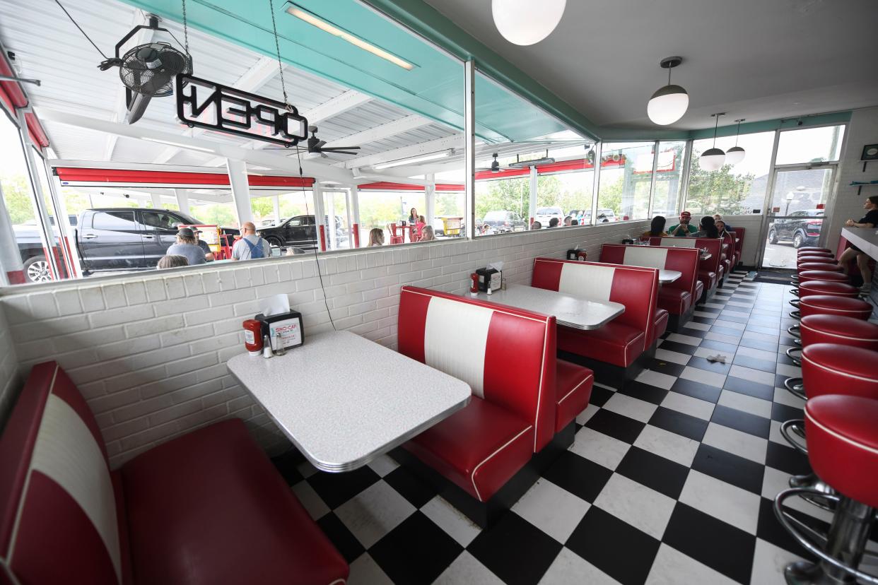 Tables sit ready for customers at the Sno-Cap Drive-In in North Augusta, S.C., on Thursday, June 8, 2023. The Son-Cap Drive-In was the recipient of a preservation grant.