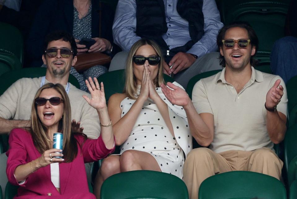 Margot Robbie and her partner Tom Ackerley are seen ahead of the semifinal match between Serbia's Novak Djokovic and Italy's Lorenzo Musetti during the Wimbledon Tennis Championships on July 12, 2024, at All England Lawn Tennis and Croquet Club in London.