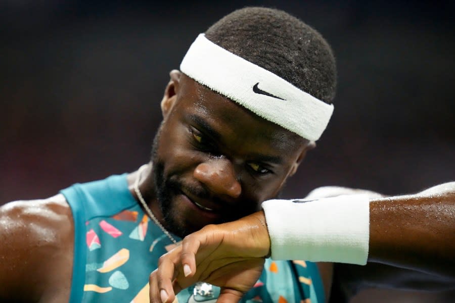 Frances Tiafoe, of the United States, wipes sweat from his face during a match against Ben Shelton, of the United States, during the quarterfinals of the U.S. Open tennis championships, Tuesday, Sept. 5, 2023, in New York. (AP Photo/Charles Krupa)