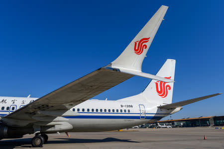 A Boeing 737 MAX 8 aircraft of Air China sits on the tarmac at an airport in Beijing, China March 11, 2019. REUTERS/Stringer/Files