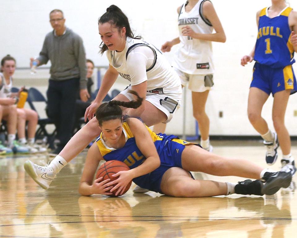 Hull’s Elly Thomas dives for the loose ball before Cohasset's Sarah Chenette can get to it during second quarter action of their game against Cohasset at Cohasset High on Friday, Jan. 6, 2023. 
