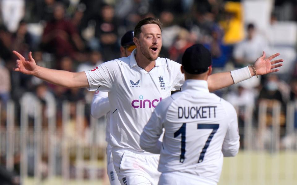 England's Ollie Robinson celebrates after taking the wicket of Pakistan's Saud Shakeel during the fifth day of the first test cricket match between Pakistan and England, in Rawalpindi, Pakistan, Monday, Dec. 5, 2022 - AP Photo/Anjum Naveed