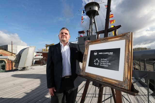 Captain John Rees on HMS Caroline docked in Belfast 