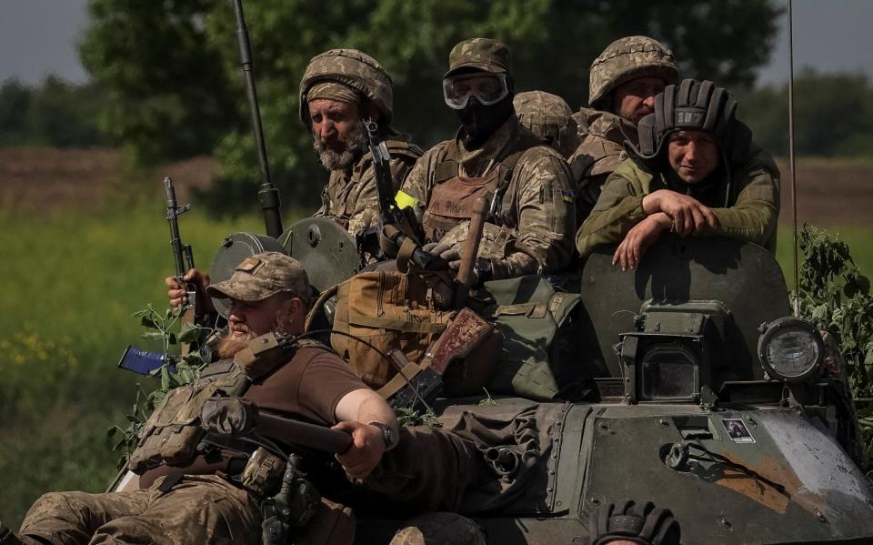 Ukrainian soldiers in a tank in the Donetsk region, where there has been heavy fighting - Reuters/Gleb Garanich