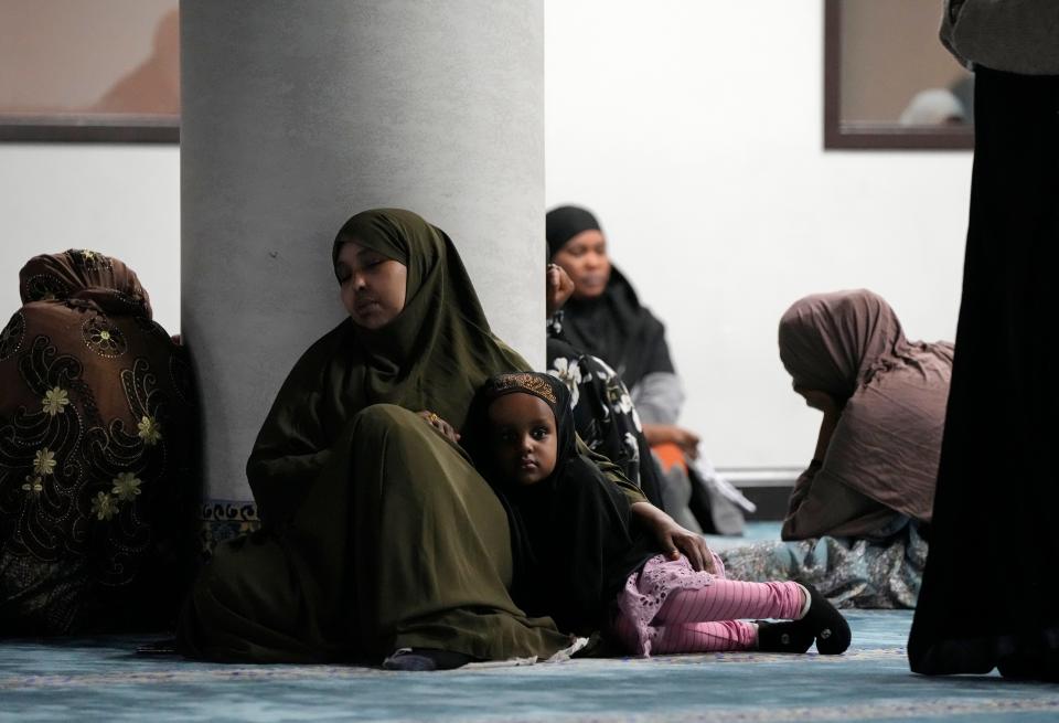 Women and children wait for a prayer session to begin Dec. 8, 2023, at Abubakar Assidiq Islamic Center on Columbus' West Side.