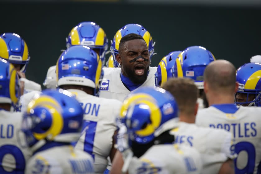 Los Angeles Rams' Michael Brockers, middle, speaks to his teammates before an NFL divisional playoff football game.