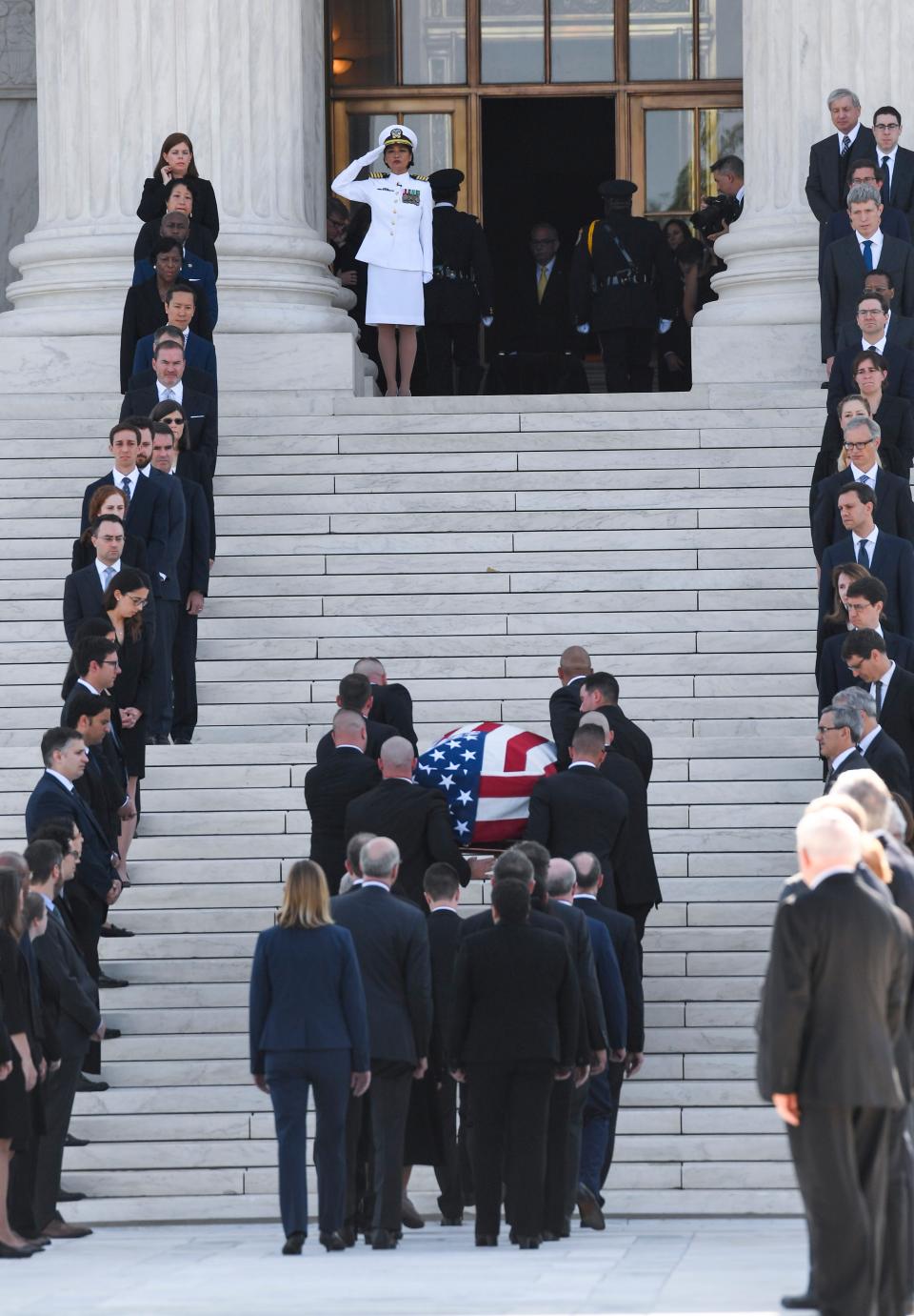 The casket of retired Associate Justice John Paul Stevens arrives and will lie in repose in the Great Hall of the Supreme Court in Washington, D.C., on Monday, July 22, 2019.