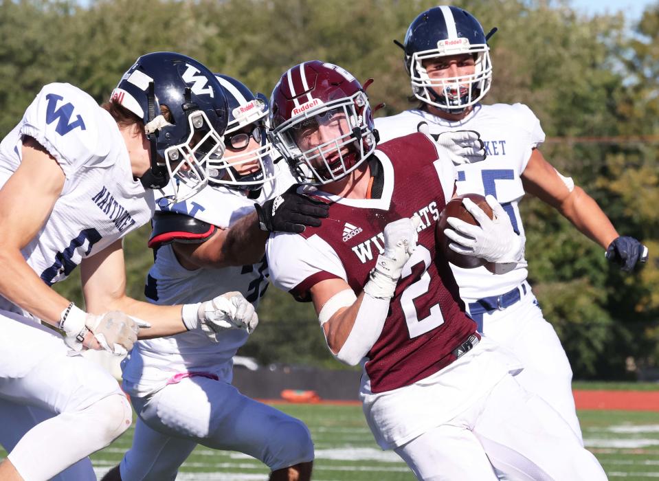 West Bridgewater running back Will DeLuca is tackled by  Nantucket's Sam Cristler during a game on Saturday, Sept. 24, 2022.  