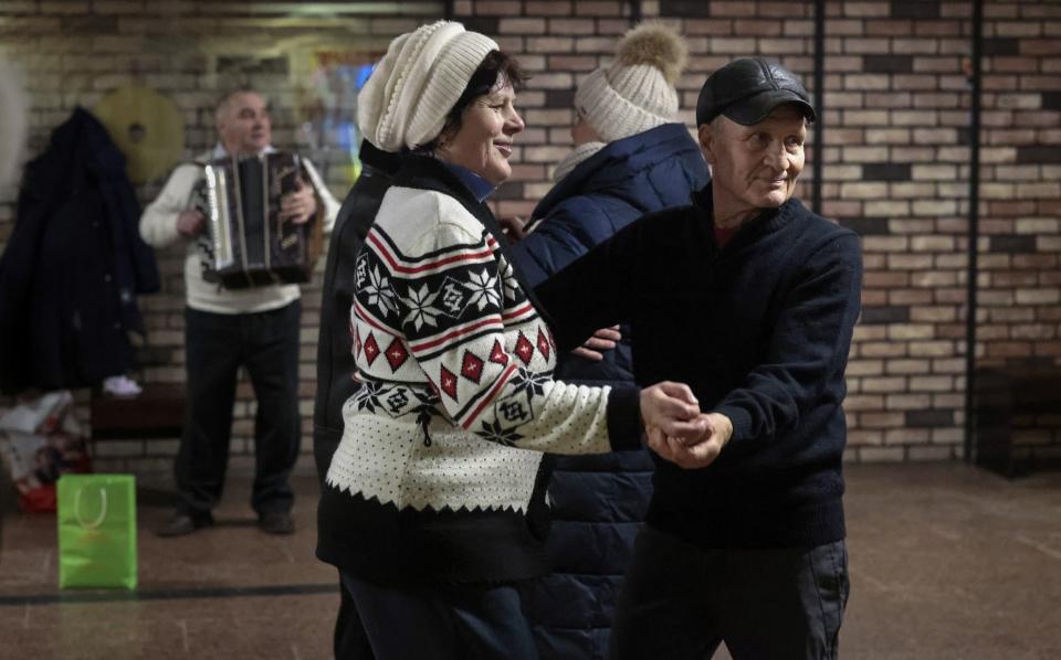 KYIV, UKRAINE - NOVEMBER 27: Senior citizens dance in a metro station underpass on November 27, 2022 in Various Cities, Ukraine. In recent days, Russia has retreated from the Ukrainian city of Kherson, allowing Ukraine to reclaim swaths of nearby territory occupied since shortly after the Russian invasion on February 24, 2022. (Photo by Jeff J Mitchell/Getty Images) - Jeff J Mitchell/Getty Images