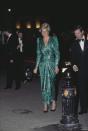 <p>Diana stunned in a shimmery green gown by British fashion designer Catherine Walker.</p>