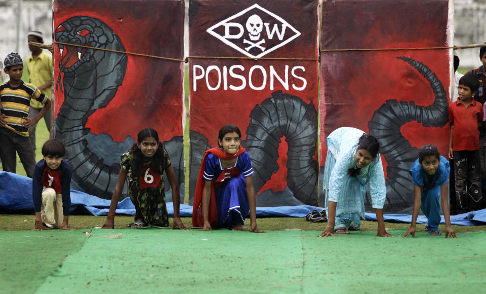 Children suffering with birth defects compete in a 25 meters sprint event during a "Special Olympics" held by the survivors of the deadly 1984 Bhopal gas leak in an effort to shame Olympic sponsor Dow Chemical Co. on the eve of the London Games in Bhopal, India, Thursday, July 26, 2012. Survivors say Dow owes them compensation for the world's worst industrial disaster and have campaigned to have the chemical giant dropped as a sponsor of the Olympics. Dow says it has no liability because it bought the company responsible for the plant more than a decade after the cases had been settled. (AP Photo/Altaf Qadri)