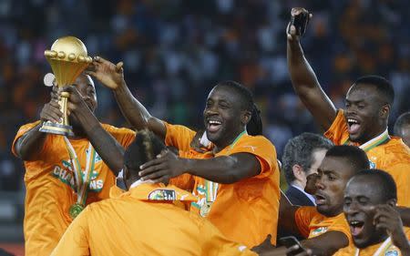 Ivory Coast's captain Yaya Toure (C) celebrates with team mates after winning the African Nations Cup final soccer match against Ghana in Bata February 8, 2015. REUTERS/Amr Abdallah Dalsh