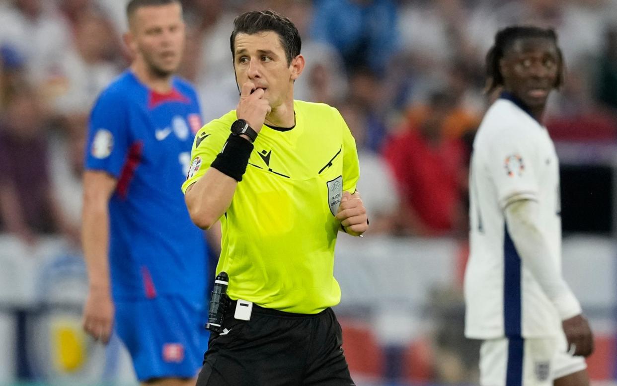 Referee Halil Umut Meler during the round-of-16 match between England and Slovakia at Euro 2024 in Gelsenkirchen, Germany