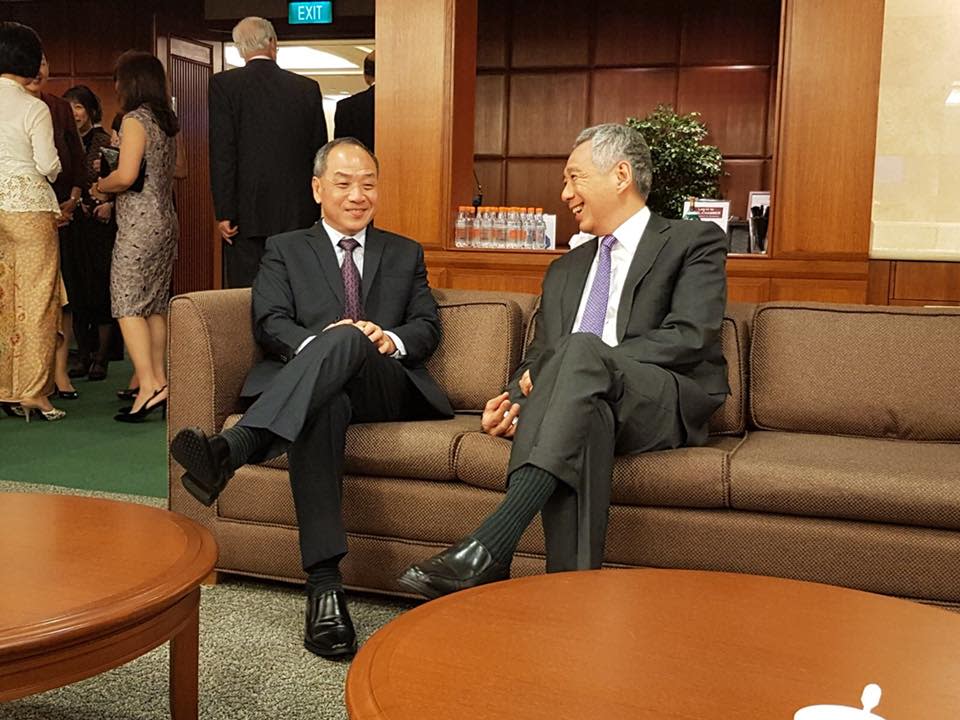 Former Workers’ Party chief Low Thia Khiang and Prime Minister Lee Hsien Loong seen having a chat at Parliament House. (PHOTO: Facebook / The Workers’ Party)