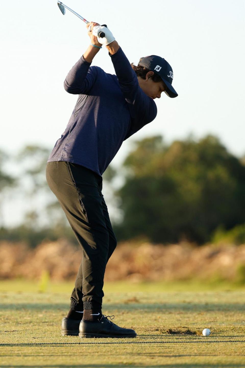 PHOTO: Charlie Woods warms up prior to pre-qualifying for The Cognizant Classic in The Palm Beaches at Lost Lake Golf Club on Feb. 22, 2024 in Hobe Sound, Fla. (Cliff Hawkins/Getty Images)