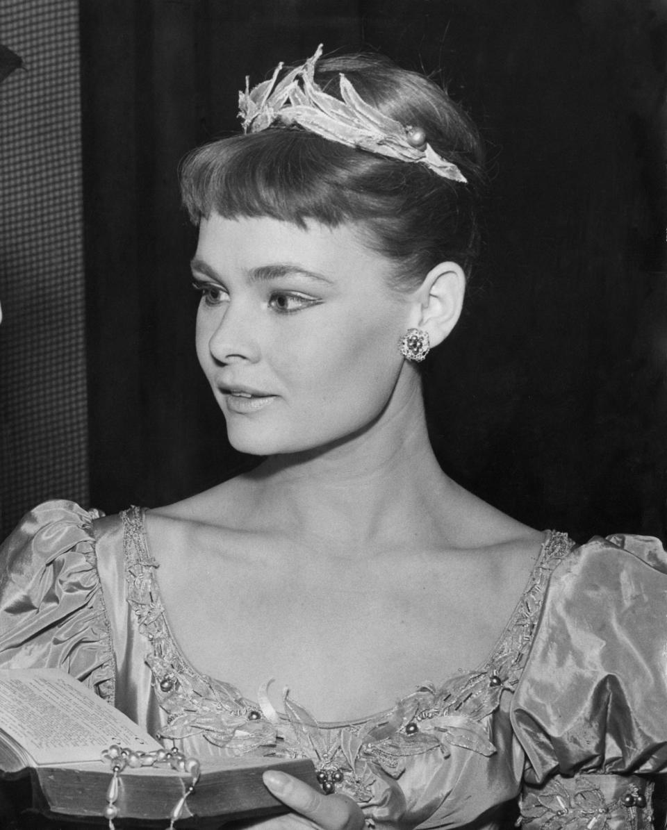 Young Judi in a dress as Ophelia in "Hamlet" in 1957