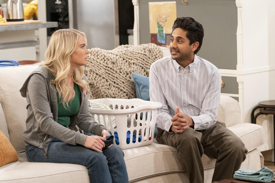 In this image provided by CBS, Kelli Goss, left, as Vanessa, and Adhir Kalyan as Al, appear in a scene from "United States of Al." (Robert Voets/CBS via AP)