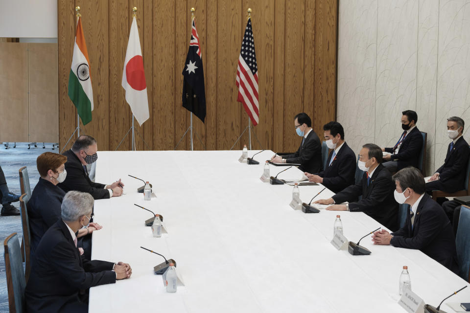 From bottom to top at left, Indian Minister of External Affairs Subrahmanyam Jaishankar, Australia Foreign Minister Marise Payne and U.S. Secretary of State Mike Pompeo meet with Japanese Foreign Minister Toshimitsu Motegi, right bottom, and Japanese Prime Minister Yoshihide Suga, second right, as they sit for a four Indo-Pacific nations' foreign ministers meeting at the prime minister's office in Tokyo Tuesday, Oct. 6, 2020. (Nicolas Datiche/Pool Photo via AP)