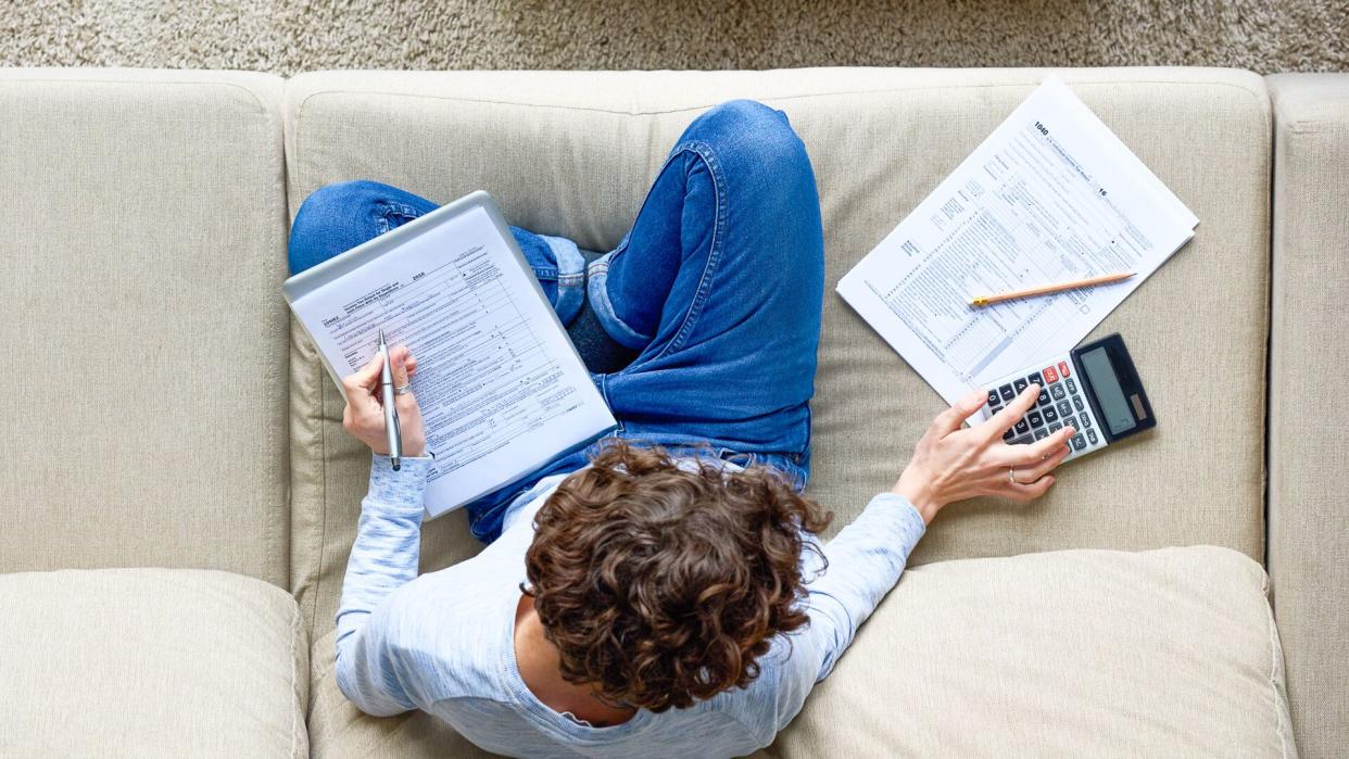 man finishing Tax-preparation at home