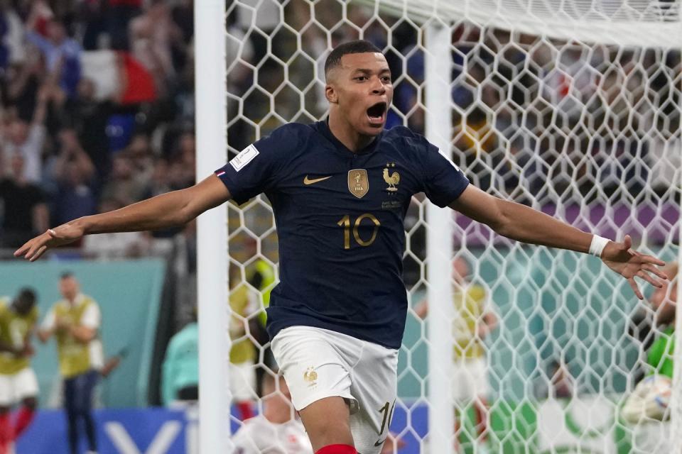 France's Kylian Mbappe celebrates after scoring his sides second goal during the World Cup group D football match between France and Denmark, at the Stadium 974 in Doha, Qatar, Saturday, Nov. 26, 2022. (AP Photo/Thanassis Stavrakis)