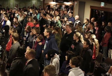 People attend a community vigil at the Grove Church following a shooting at Marysville-Pilchuck High School in Marysville, Washington October 24, 2014. REUTERS/Jason Redmond