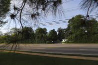 Washington Road looks deserted in front of the main gate at Magnolia Road that leads to the Augusta National Golf Club clubhouse on Monday, April 6, 2020, in Augusta, Ga. When Augusta comes up, one instantly thinks of the Masters. For cities like Augusta the shutdown caused by the coronavirus pandemic is an especially wrenching blow. (Curtis Compton/Atlanta Journal-Constitution via AP)