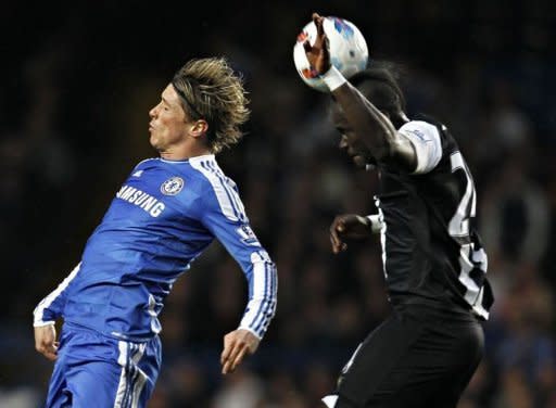 Chelsea's Fernando Torres (L) and Newcastle United's Cheick Tiote during their Premier League match on May 2. Newcastle took advantage of Chelsea's tired performance to boost their own challenge for a Champions League place