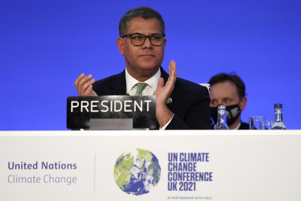 Alok Sharma President of the COP26 summit applauds after speaking during the closing plenary session at the COP26 U.N. Climate Summit in Glasgow, Scotland, Saturday, Nov. 13, 2021. Going into overtime, negotiators at U.N. climate talks in Glasgow are still trying to find common ground on phasing out coal, when nations need to update their emission-cutting pledges and, especially, on money. (AP Photo/Alberto Pezzali)