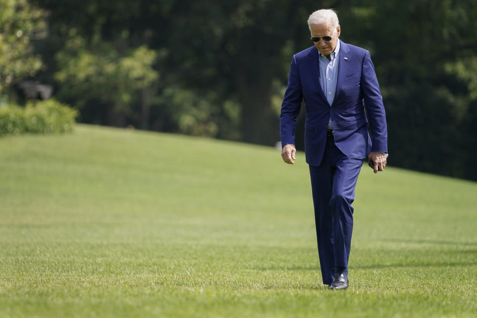 President Joe Biden walks on the South Lawn of the White House after stepping off Marine One, Sunday, July 25, 2021, in Washington. Biden is returning to Washington after spending the weekend in Delaware. (AP Photo/Pablo Martinez Monsivais)