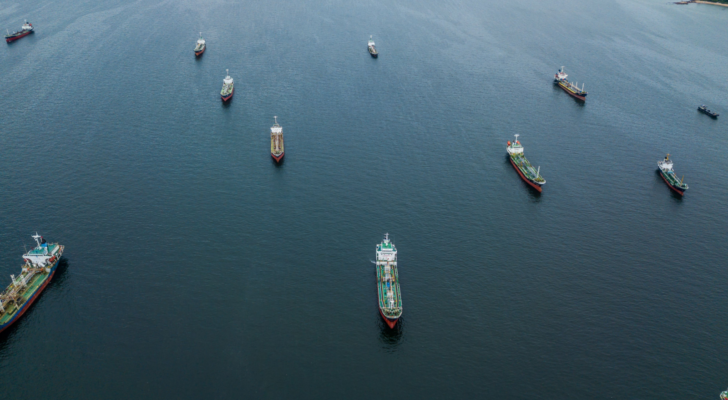 Crude oil tanker and LPG Loading in port at sea view from above. Aerial view oil tanker ship shot from drone. Oil prices, oil shipping, oil stocks.