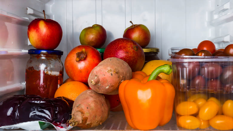 Pomegranates and other fruits in fridge