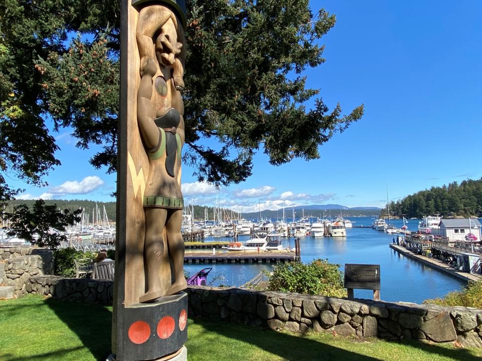 The painted house post is a symbol of welcome at the port of Friday Harbor, San Juan Island, Wash. Titled ÒInteraction,Ó the sculpture acknowledges the native presence in the San Juan Islands. Salish Coast artist Susan Point, a member of the Musqueam Tribe, created the red cedar carving. 