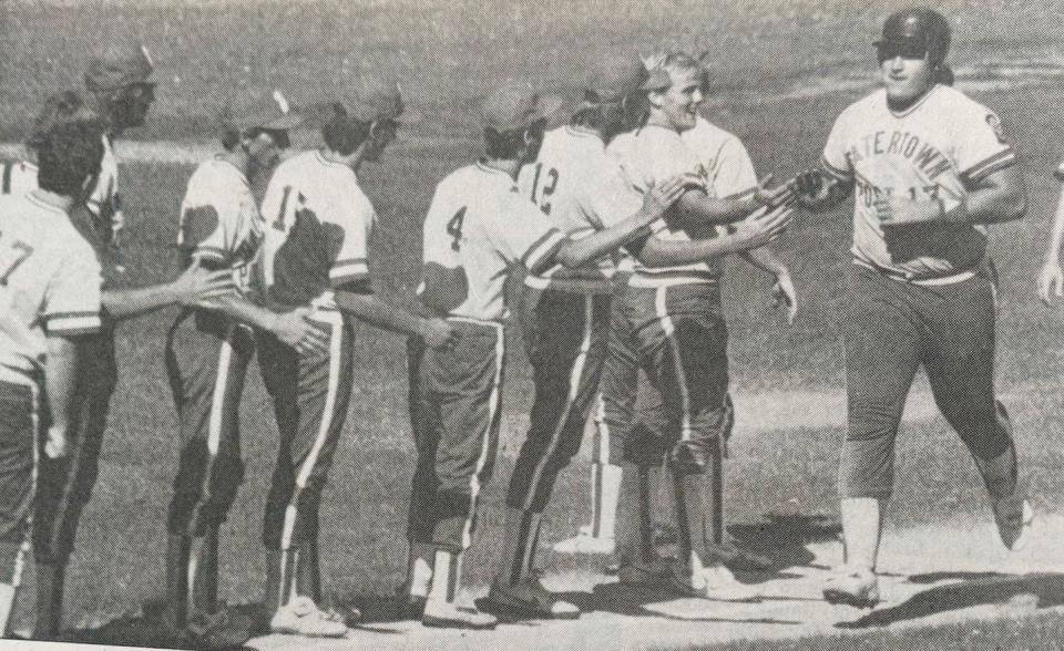 Watertown Post 17 slugger Jay Walter receives congratulations from his teammates after hitting a homer during a 1986 American Legion Baseball doubleheader at Watertown Stadium.