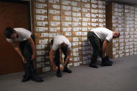 <p>New U.S. Border Patrol trainees try on boots while being fitted for uniforms at the U.S. Border Patrol Academy on August 3, 2017 in Artesia, N.M. (Photo: John Moore/Getty Images) </p>