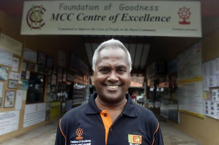 Kushil Gunasekera poses for a photograph at the Foundation of Goodness village project in Seenigama December 20, 2014. REUTERS/Dinuka Liyanawatte