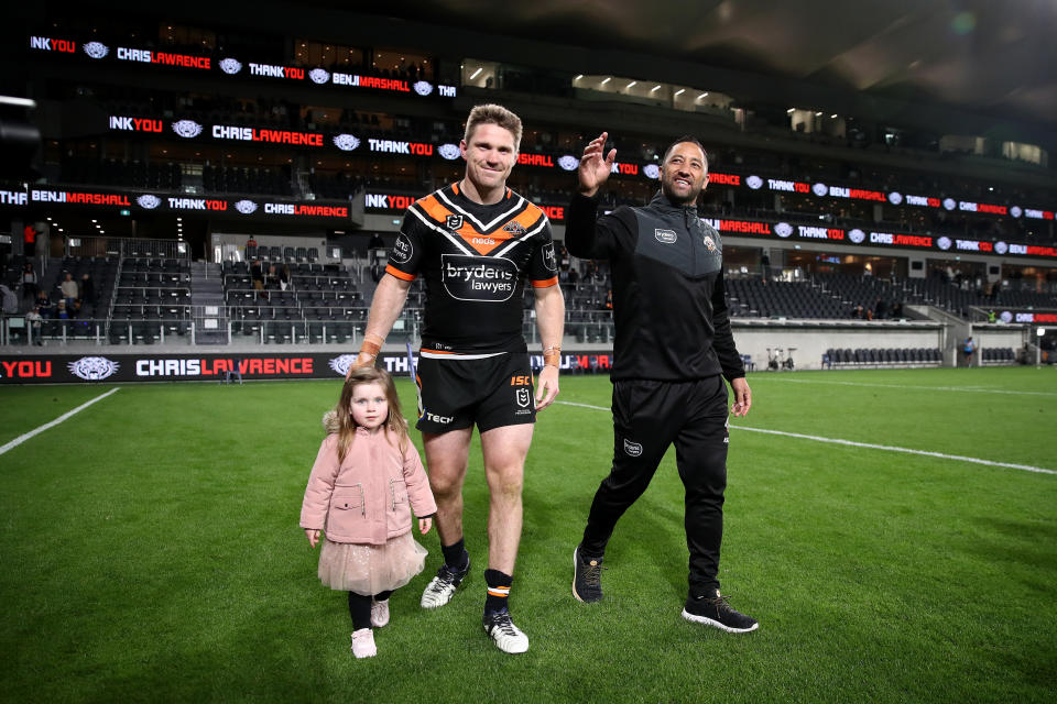 Benji Marshall and Chris Lawrence thank fans after playing their last game for the Tigers.