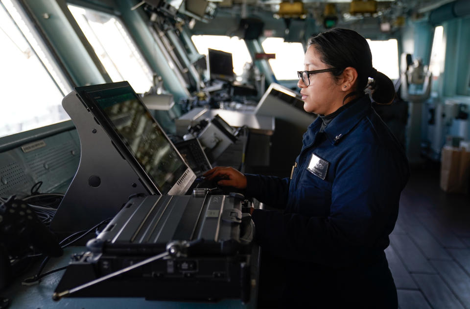 A crew member works on the bridge of the USS Gerald R. Ford, the 'world's largest warship', during a media visit while it is anchored in the Solent during a stopover in Portsmouth on it's maiden deployment. Picture date: Thursday November 17, 2022. (Photo by Andrew Matthews/PA Images via Getty Images)