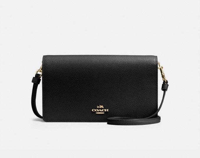 Hayden Foldover Crossbody Clutch. Image via Coach.