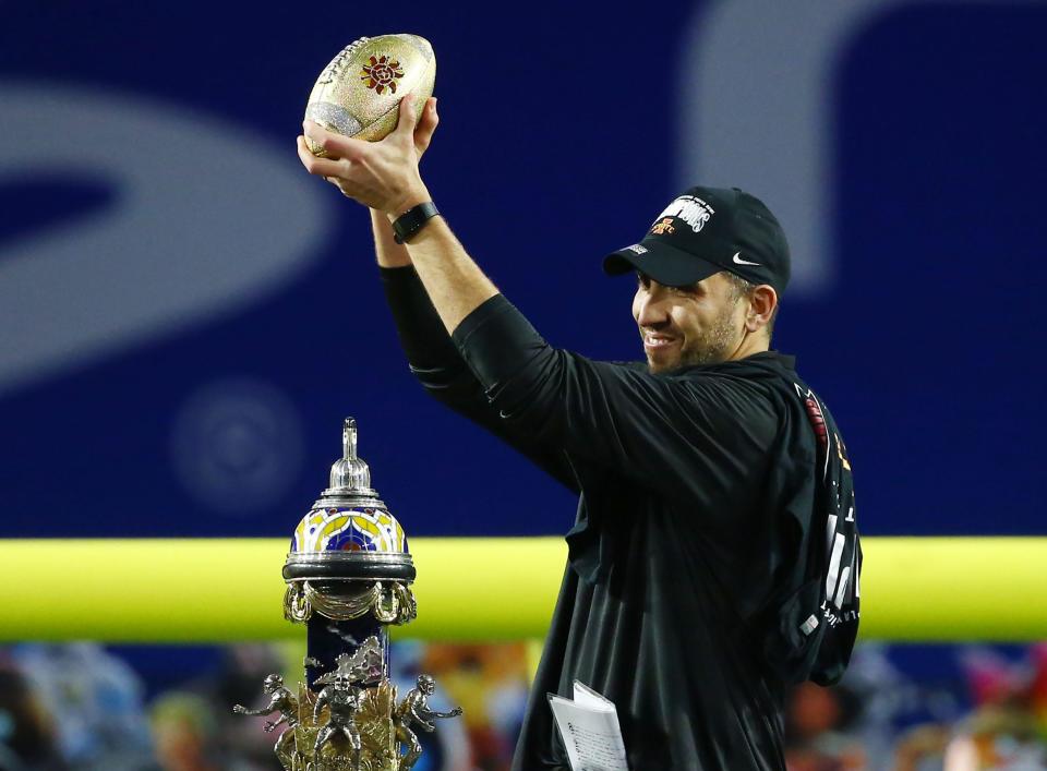 Iowa State coach Matt Campbell hoists the trophy after the Cyclones' 34-17 victory against Oregon in the 2021 Fiesta Bowl.