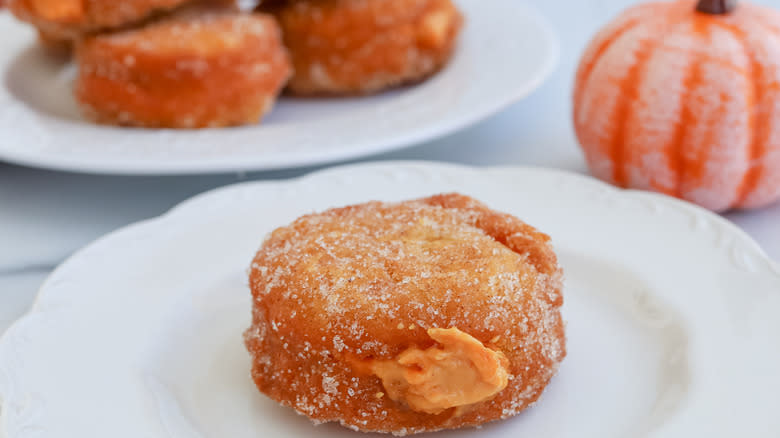 pumpkin filled donut on plate