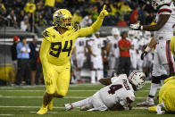 Oregon defensive tackle Sua'ava Poti (94) celebrates after sacking Stony Brook quarterback Tyquell Fields (4) during the third quarter of an NCAA college football game Saturday, Sept. 18, 2021, in Eugene, Ore. (AP Photo/Andy Nelson)