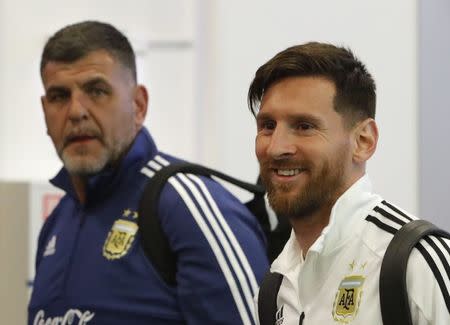 Soccer Football - FIFA World Cup - Argentina Arrival - Zhukovsky International Airport, Moscow Region, Russia - June 9, 2018. Lionel Messi (R) walks at the airport. REUTERS/Sergei Karpukhin