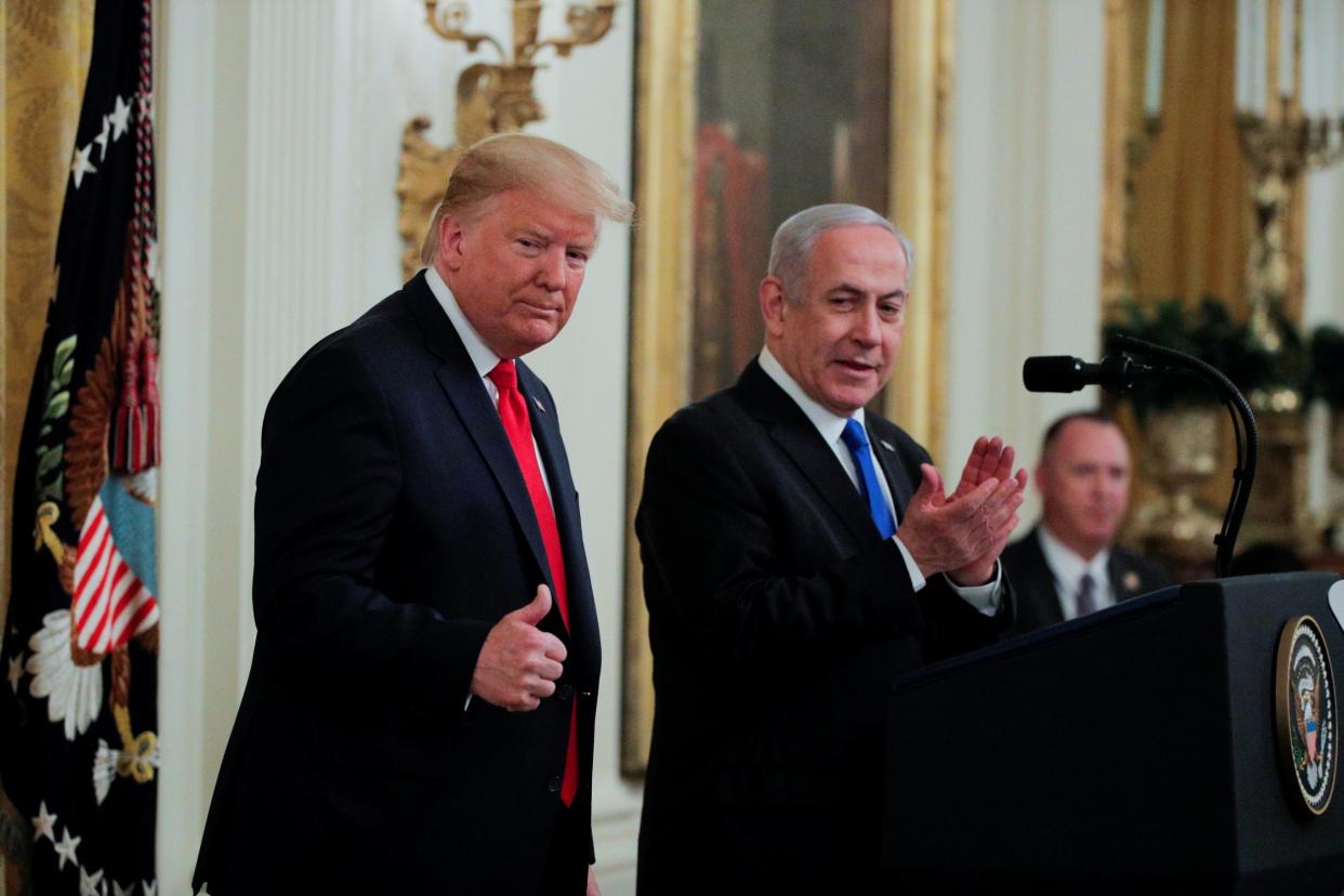 Donald Trump gives a thumbs up to Benjamin Netanyahu during a White House news conference on 28 January 2020: Reuters