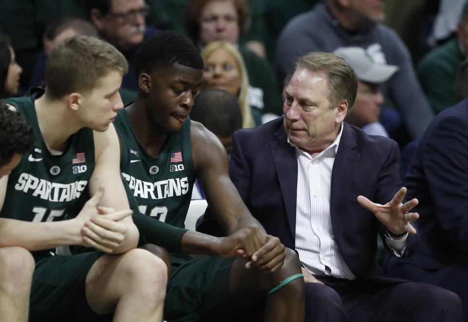 Michigan State head coach Tom Izzo talks with Michigan State forwards Thomas Kithier, left, and Gabe Brown, center, during the second half of an NCAA college basketball game against Nebraska, Tuesday, March 5, 2019, in East Lansing, Mich. (AP Photo/Carlos Osorio)