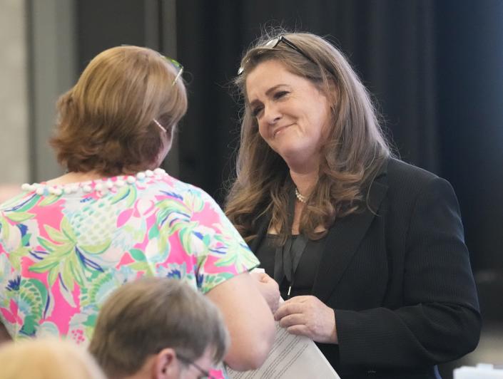 Liz Harris greets people on April 17, 2023, during a Legislative District 13 meeting to nominate three candidates to replace her after she was expelled as state House of Representatives member.
