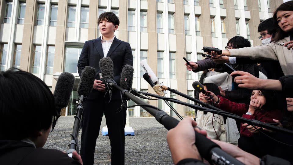 Rina Gonoi speaks to the media after the Fukushima court on December 12, 2023 found three perpetrators guilty of "forced indecency" towards her during her service at the JSDF. - Kazuhiro Nogi/AFP/Getty Images/File