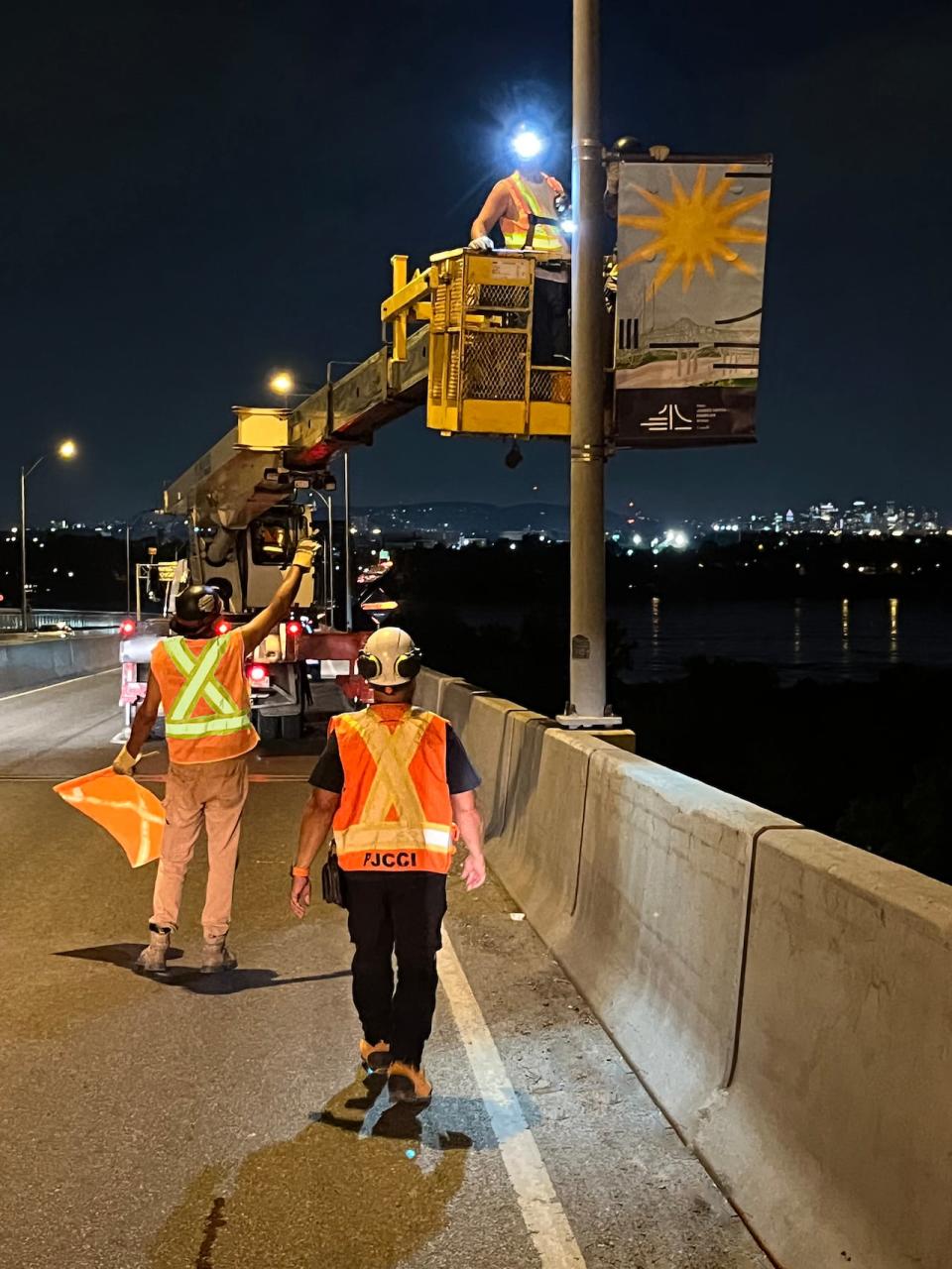 Installation of the banners on the Honoré Mercier Bridge took place earlier this summer.